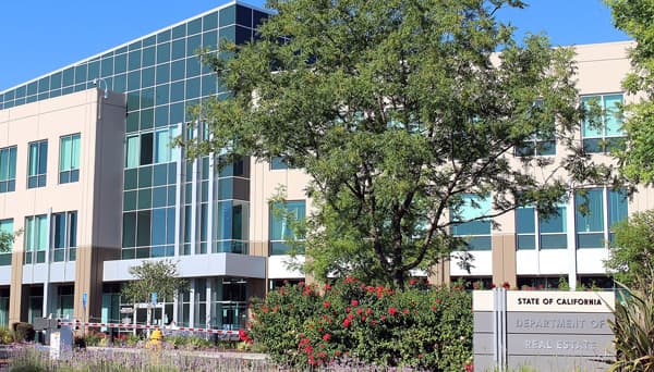 Broker Hughes Appeals Revoked License After Conviction